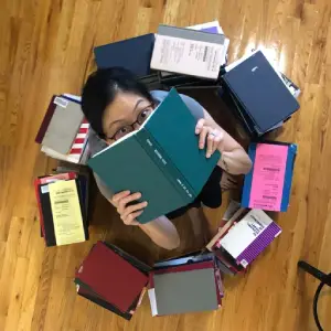 Diana in pile of books